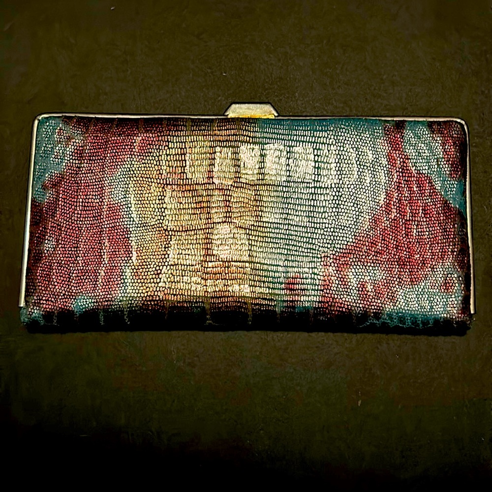 Slim silver tone multi color soft wallet. Pre-loved condition.
